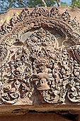 Banteay Srei temple - ancillary building of the causeway, Vishnou in the form of Narasimha holds upside-down Hiranya-Kasipu, the king of the Asuras